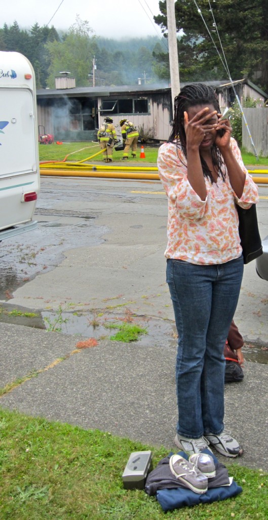 IMG_0589 Melinda McCarin grieves the loss of her home as the fire is put out. KLH | Ee