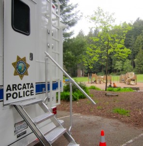 Two guys sat in the park, away from the incredible volume of noxious fumes the Critical Incident Response Vehicle puts out while running the generator for electricity. The two guys weren't in a real good mood.
