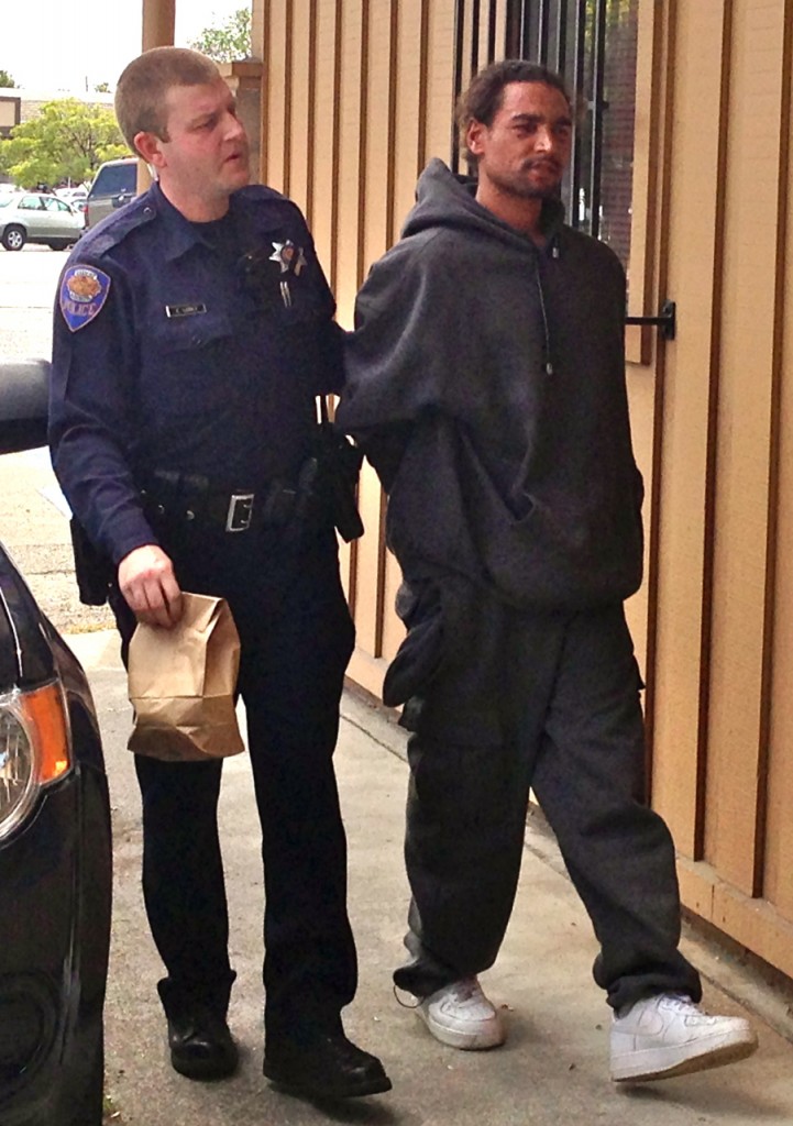 Homicide suspect Bodhi Tree is led into APD. KLH | Eye