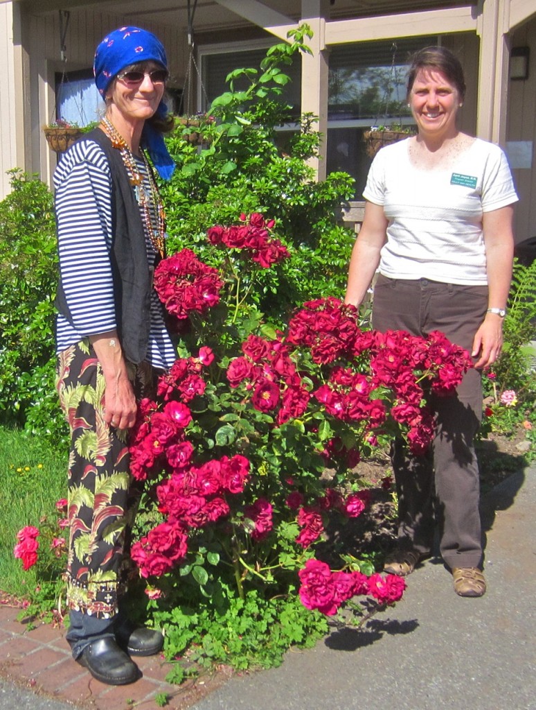 Virginia Moyer (it was Dress Like A Pirate Day) and April Joyce with one of the flower bushes that wasn’t stolen. KLH | Eye