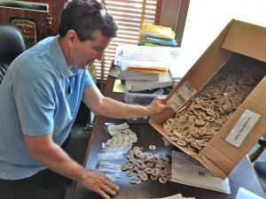 Bill Chino begins the unenviable task of counting beer chips and ticket stubs in his Jacoby’s Storehouse office. 