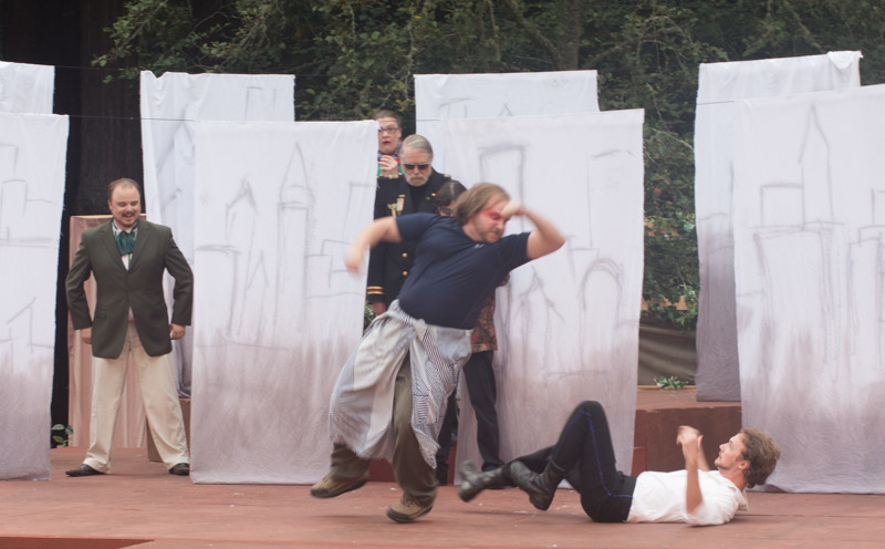 Charles the Wrestler (Evan Needham) about to crush Orlando (Kenneth Wrigley) – or is he? Photo by Keon Kobra.