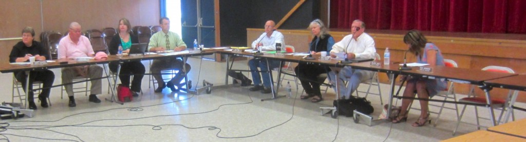 NHUHSD staff and four-fifths of its board – not including the subject of the meeting, Dan Johnson, who would have occupied the seat on the right – in the AHS Multipurpose Room. KLH Eye